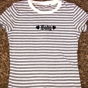 A crops striped shirt with the words baby on it